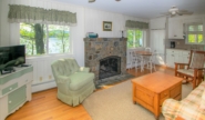Lakefront Cottage #5 living room with stone fireplace